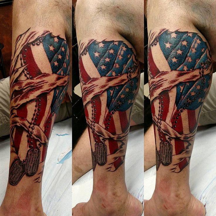 a man's leg with an american flag tattoo on it