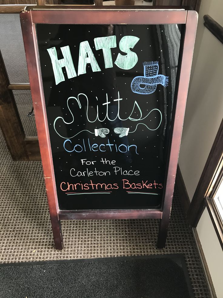 a sign that says hats, suits, and collection in front of a christmas basket