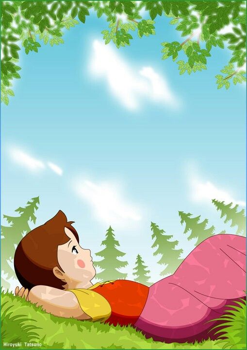 a boy laying in the grass under a tree with a pink blanket on his back