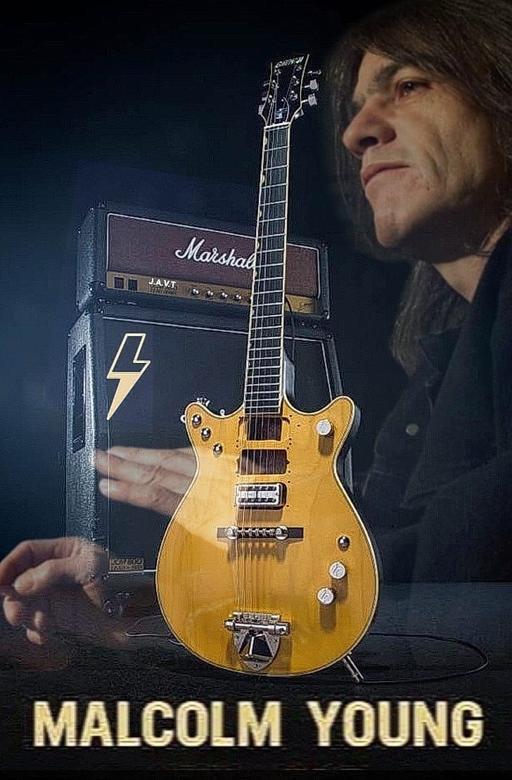 an electric guitar sitting on top of a table next to a amp with the caption malcolm young