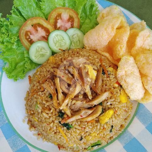 a white plate topped with rice and veggies next to cucumber slices