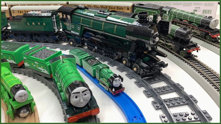 a toy train set with thomas the tank engine and other toys on top of it