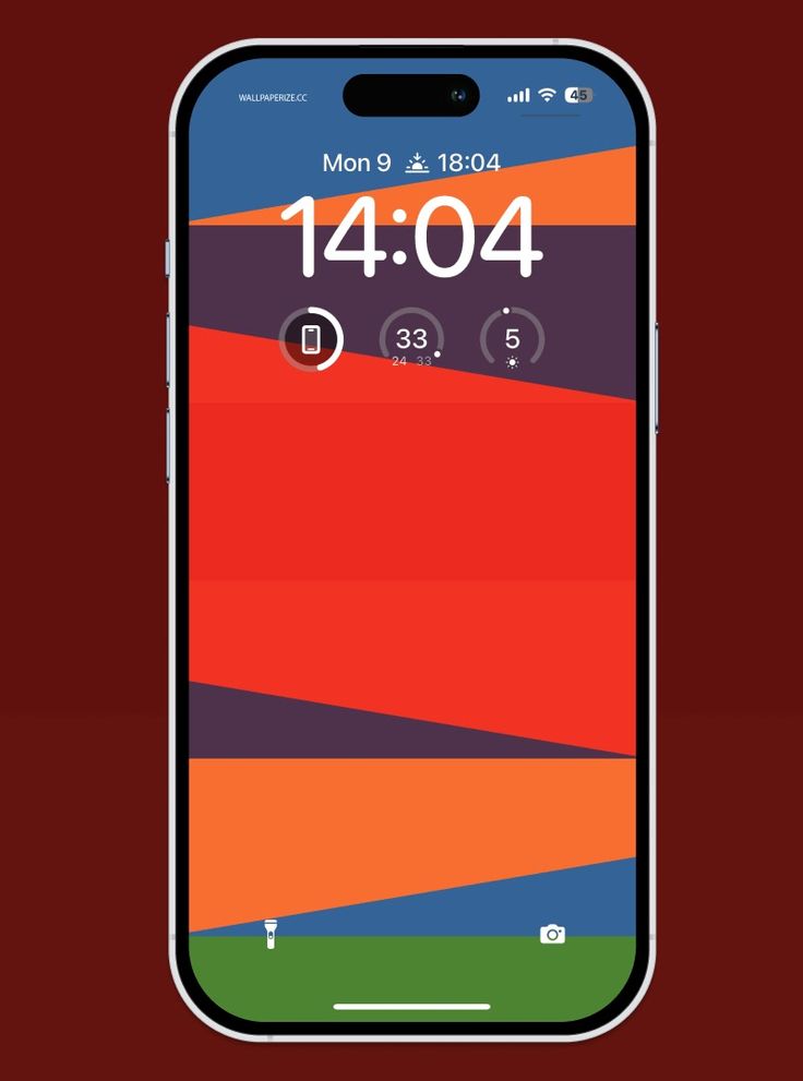 an iphone with the time displayed on it's screen, next to a red background