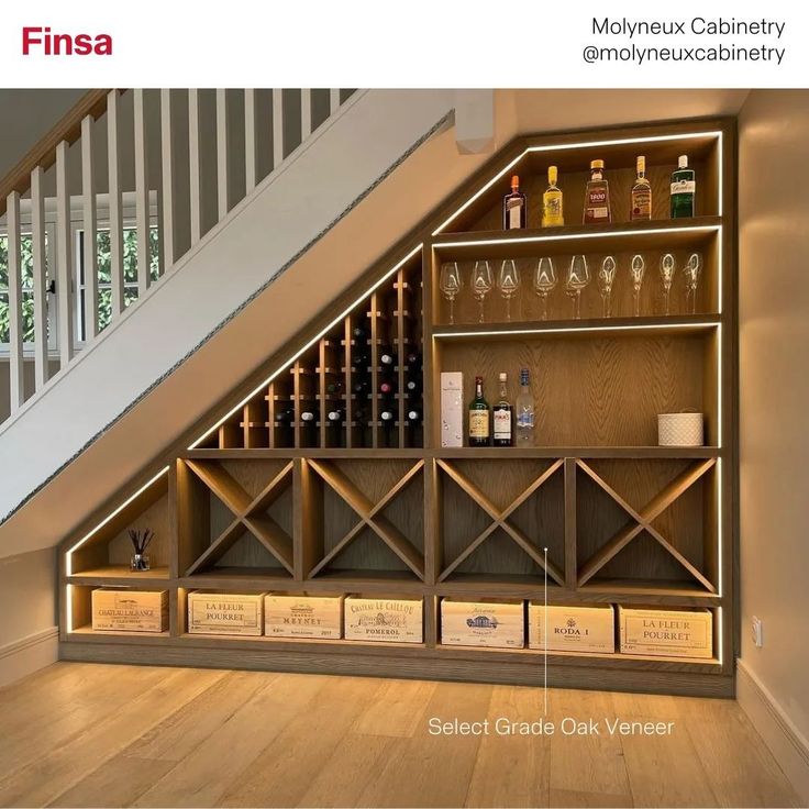 a wine rack under the stairs in a house