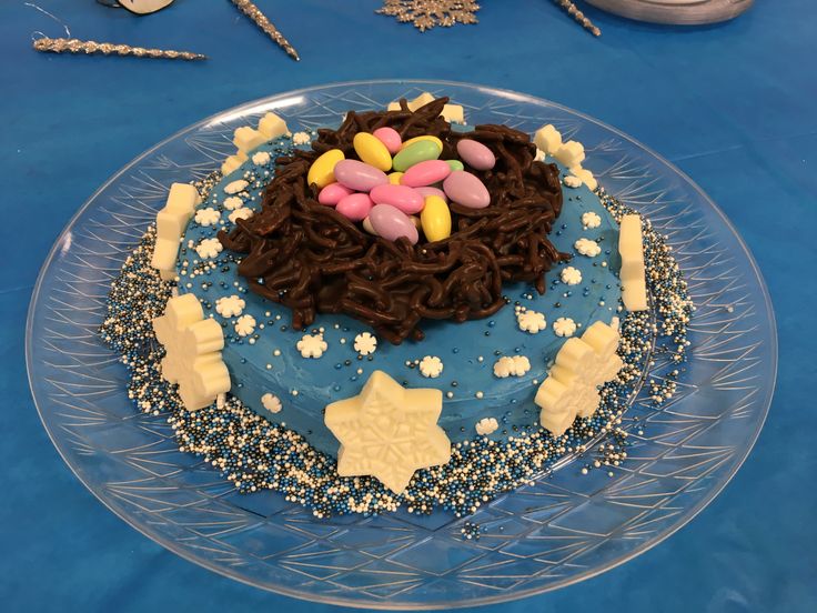 a cake decorated with chocolate icing and marshmallows