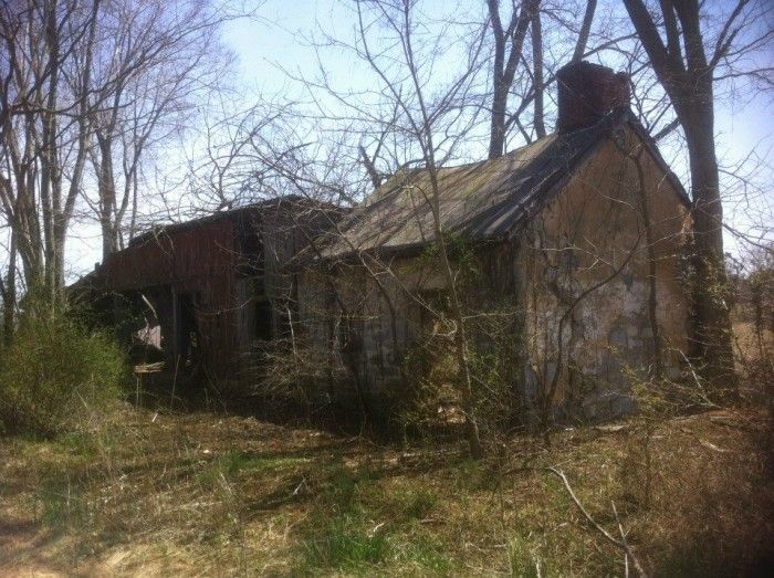 an old run down house in the woods