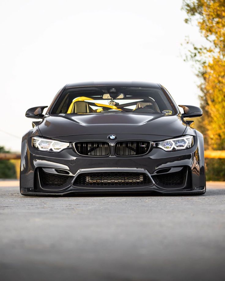 the front end of a black bmw car