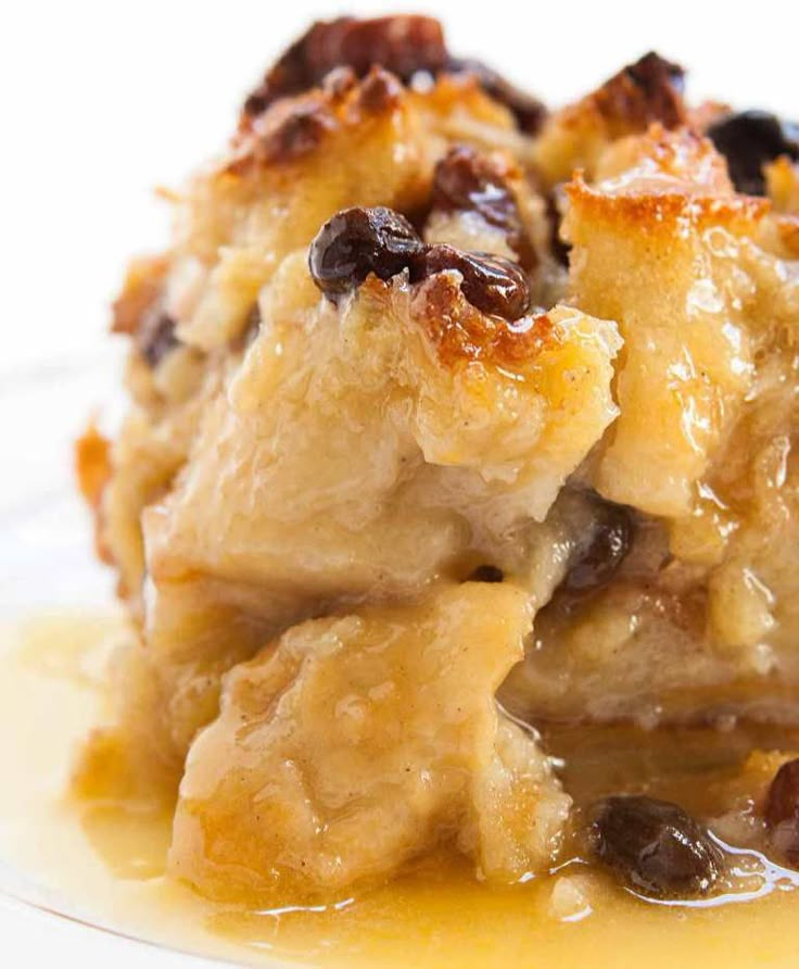 a close up of a plate of food with raisins and bread on it