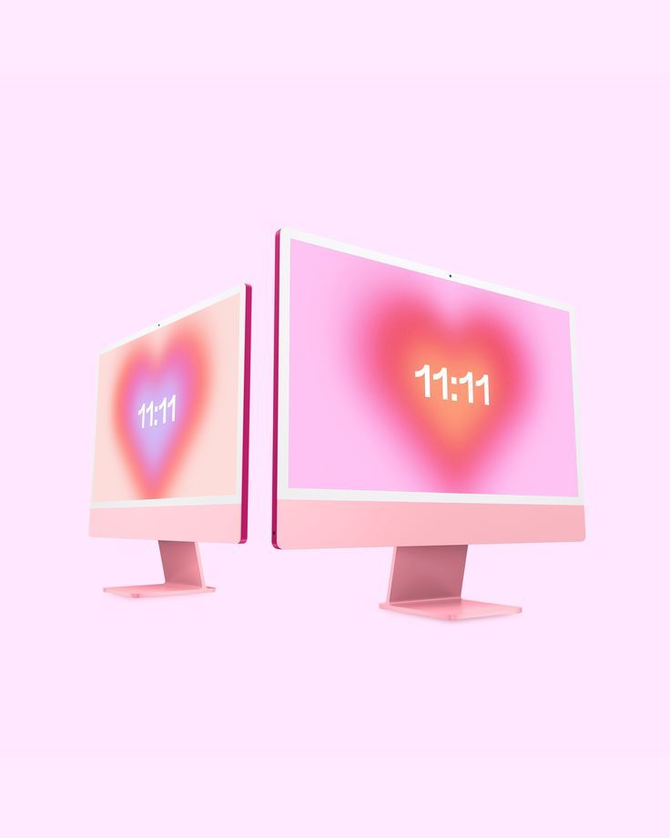 two computer monitors displaying the time in arabic and english, with heart - shaped display