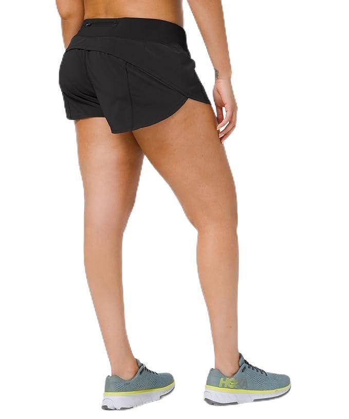 the back view of a woman in black shorts