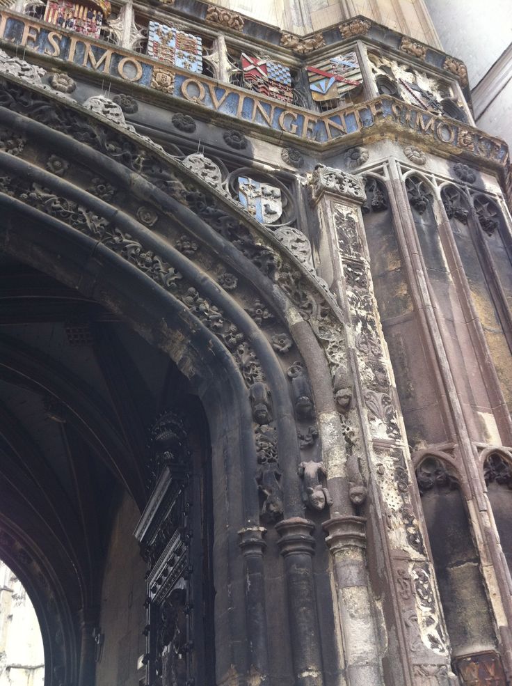 the entrance to an old building with ornate carvings