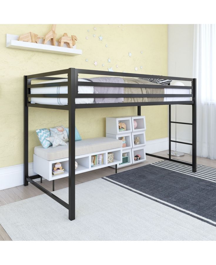 a bunk bed sitting next to a white book shelf