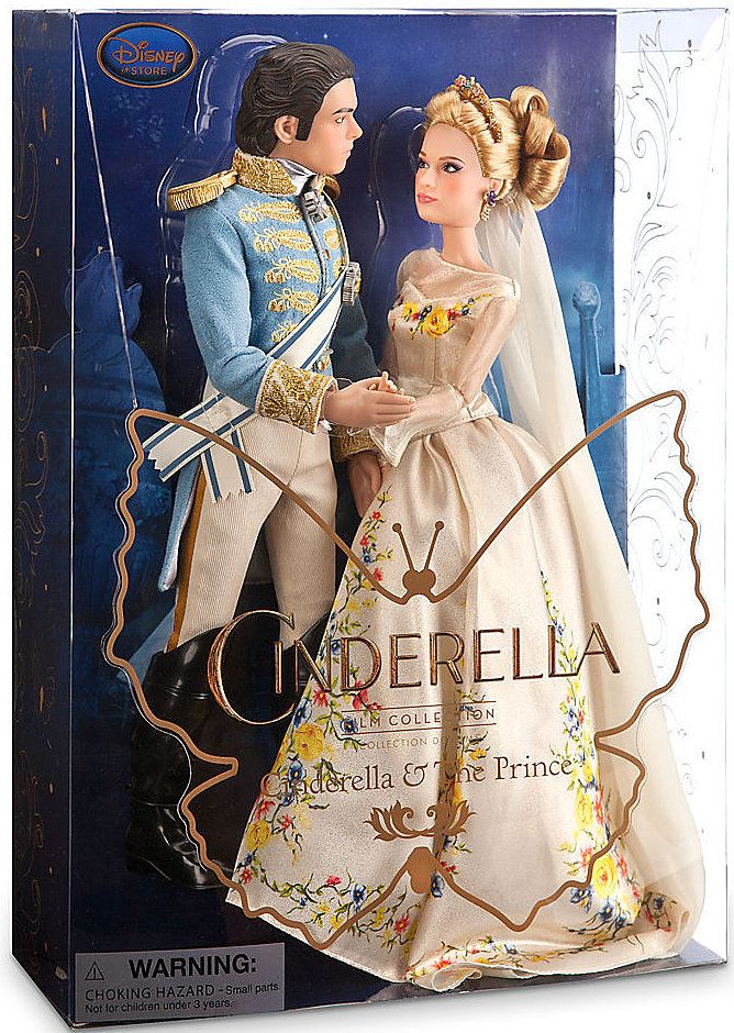 a barbie doll in a wedding dress and prince figurine is posed for a photo