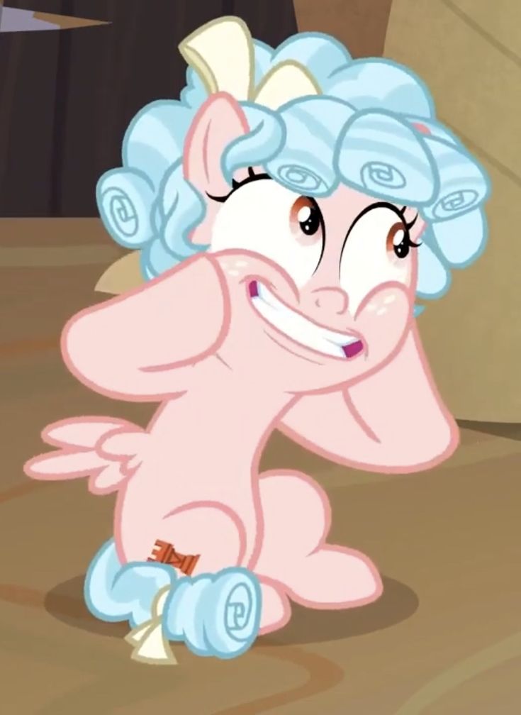 the pinkie is sitting down and smiling