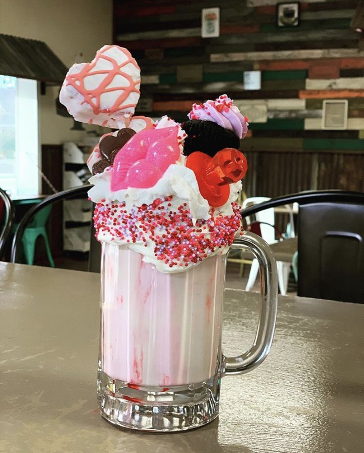 a cup filled with cake and sprinkles sitting on top of a table