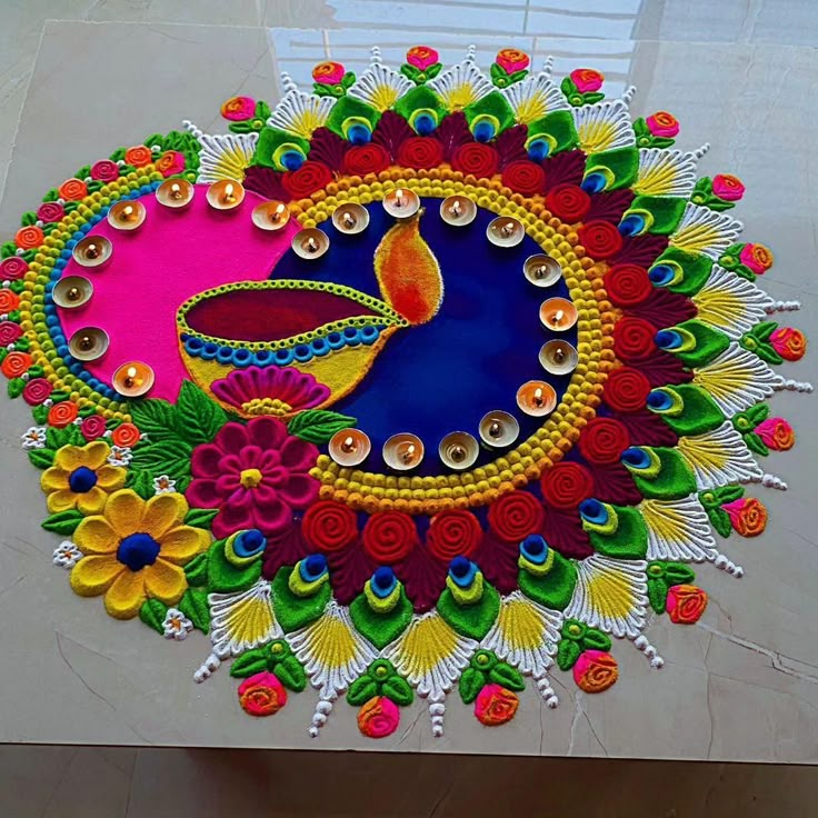 this is an image of a colorful rangolite design for diwaling on the floor