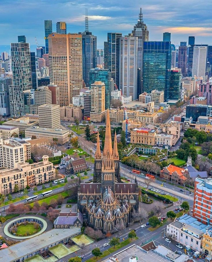 an aerial view of a city with tall buildings