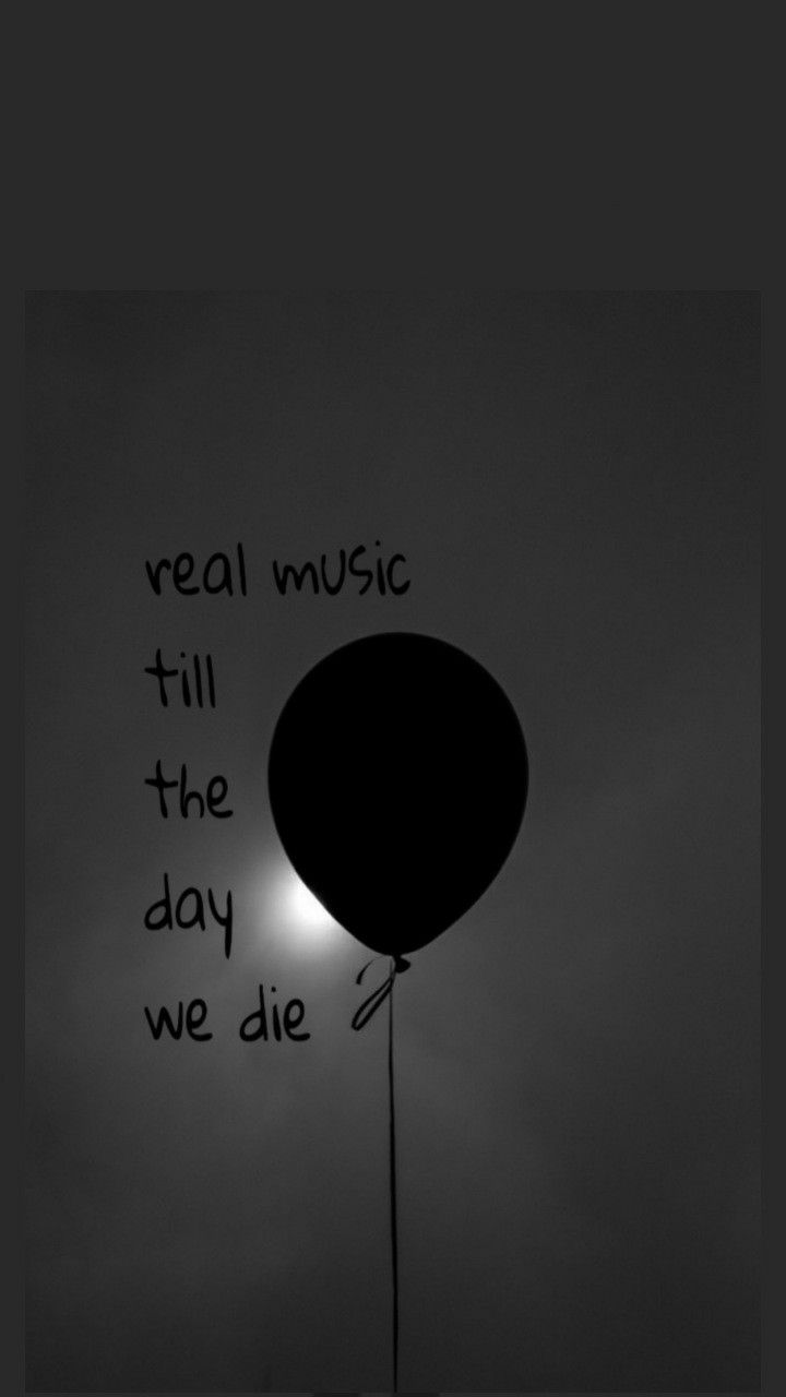 a black and white photo of a balloon with the words real music till the day we die written on it