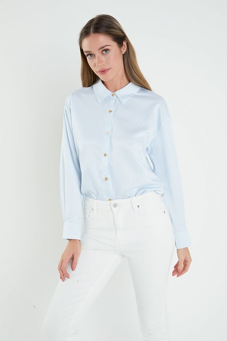 Introducing our stunning Stripe Shirt, the perfect addition to any wardrobe. Made from high-quality fabric and featuring a chic stripe pattern, this shirt will elevate your everyday look. The sophisticated collar and fashionable drop-shoulder design add a modern touch, while the pleat detail on the sleeves adds a unique flair. This stylish shirt is a must-have for any fashion-forward individual. Whether you're dressing up for work or keeping it casual, our Stripe Shirt is versatile and on-trend. Chic Vertical Stripes Shirt For Spring, Chic Vertical Stripes Blouse For Spring, Chic Vertical Striped Shirt For Spring, Chic Spring Shirt With Vertical Stripes, Chic Spring Blouse With Vertical Stripes, Spring Office Tops With Vertical Stripes, Modern Tops With Striped Collar For Work, Chic Blue Shirt For Work, Modern Top With Striped Collar For Work