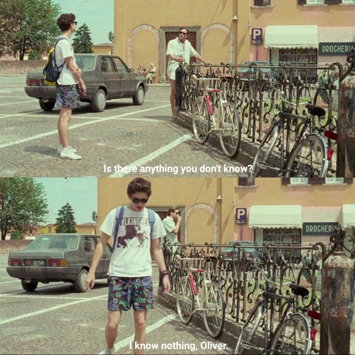 a man standing next to a bunch of bikes