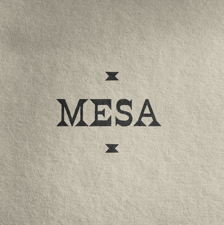 the word mesa written in black ink on a white paper with an arrow pointing to it