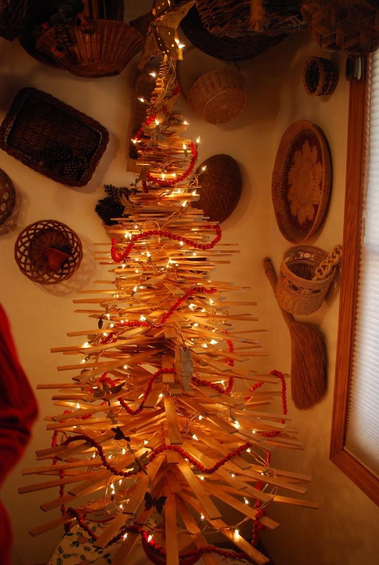 a christmas tree made out of sticks and lights