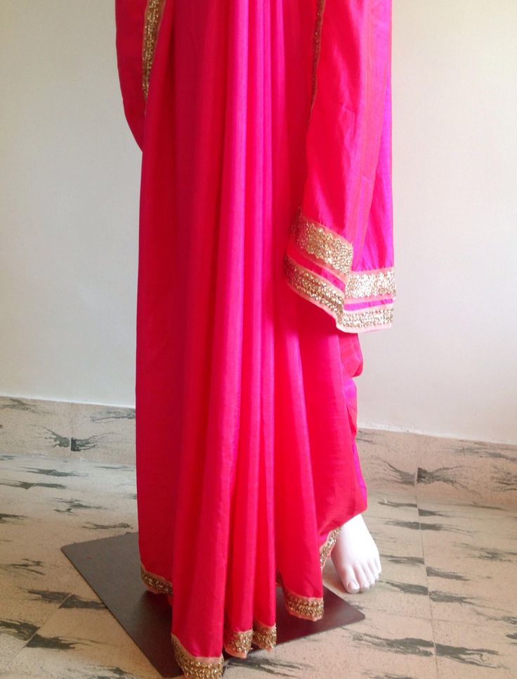 "Gorgeous glowing pink semi silk saree with a beautiful stone work border and silk unstitched blouse in blue silk brocade. The blue brocade is simply stunning when paired with the hot pink saree. Saree length 5.5 meters Blouse fabric 1 meter 44\" wide Saree ships in 2-3 days of payment.Shipping time is 4-5 days with tracking. We also offer blouse and petticoat stitching for saree as additional services. Please convo me if you need help or have any questions." Pink Raw Silk Kurta With Cutdana, Festive Pink Cutdana Churidar, Pink Raw Silk Pre-draped Saree With Dupatta, Bollywood Style Pink Cutdana Kurta, Pink Cutdana Bollywood Kurta, Pink Raw Silk Pre-draped Saree With Resham Embroidery, Traditional Pink Pre-draped Saree With Embroidered Border, Pink Kurta With Embroidered Border For Diwali, Pink Embroidered Kurta For Diwali