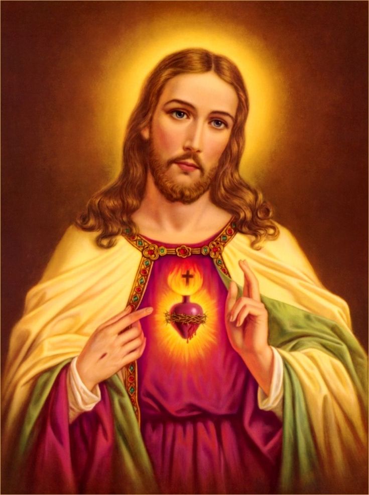 jesus holding the sacred heart of jesus in his hands with spanish words above it that read corazo de jesus en yos confio