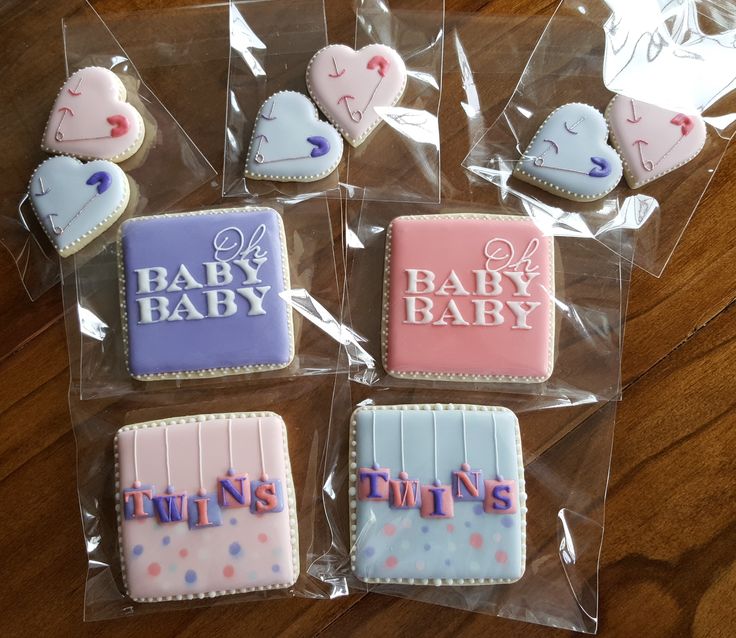 baby shower cookies in plastic bags on a table