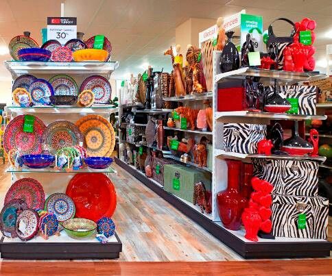 a store filled with lots of colorful plates and bowls