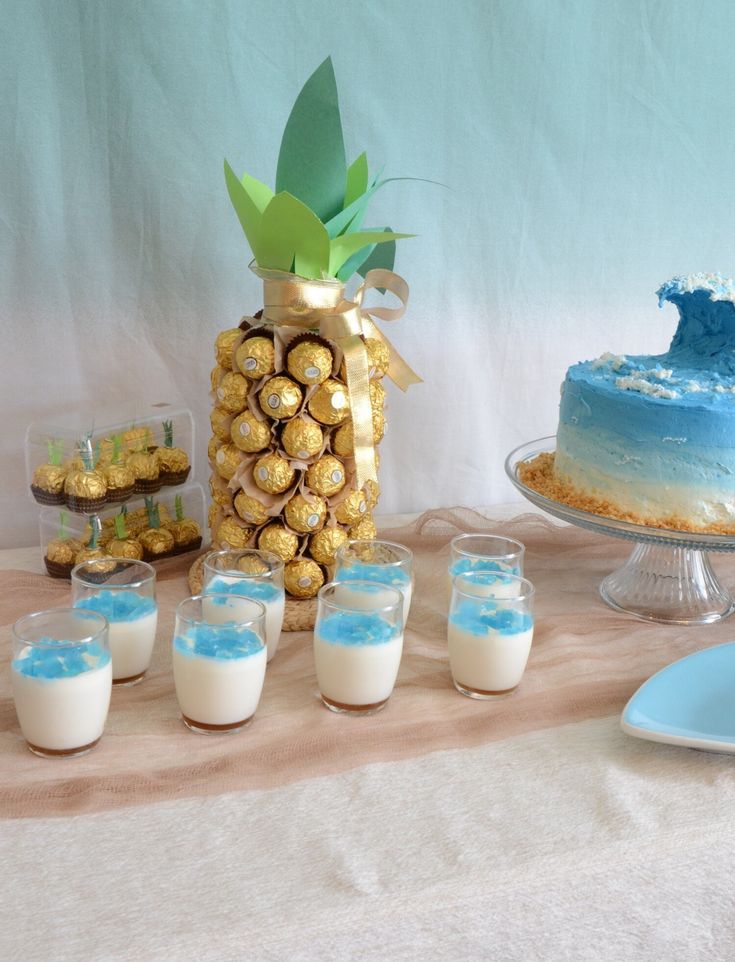 a table topped with lots of desserts and drinks