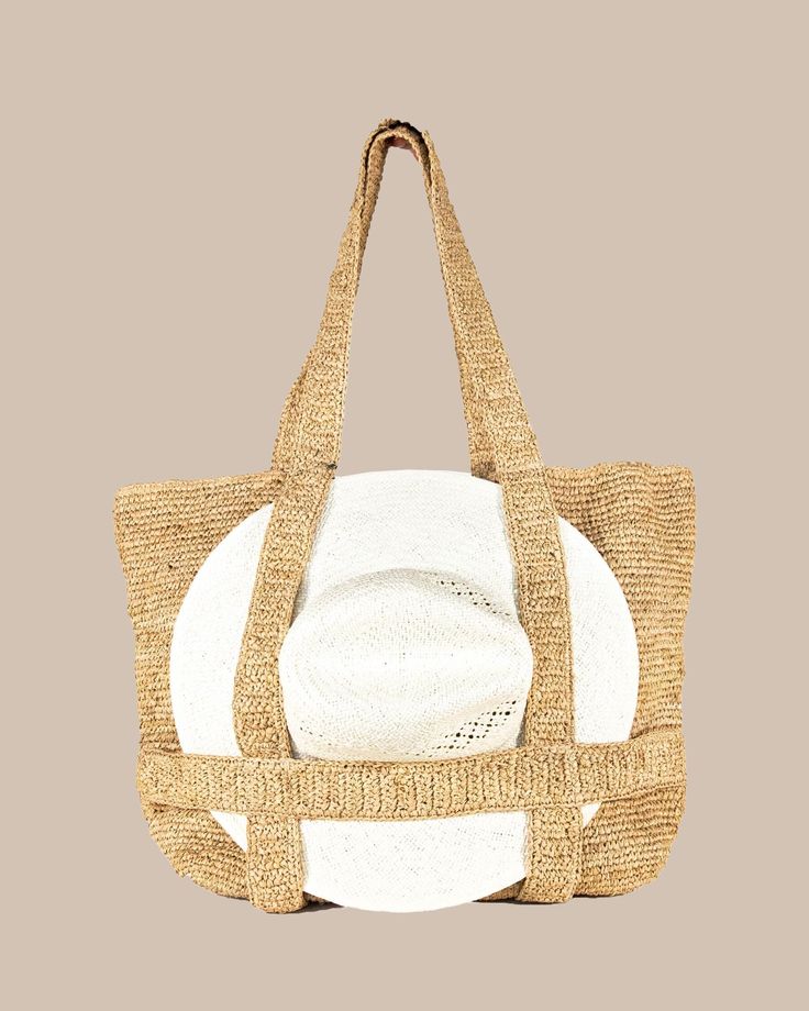 Introducing our Straw Traveler Tote - the perfect accessory to brighten up your spring and summer wardrobe! This versatile bag features a built-in spot to securely store your favorite sunhat while you're on-the-go. With its 100% Raffia Straw material and packable design, this bag is both stylish and functional. It's roomy enough to fit all of your beach day essentials measuring 20" x 14", with a convenient handle drop of 10". Style: 11041 Summer Crochet Bag With Double Handle And Removable Pouch, White Sun Hat For Beach Season Travel, White Sun Hat For Beach Travel, Spring Straw Bag With Removable Pouch And Double Handle, Spring Straw Bag With Double Handle And Removable Pouch, Spring Jute Beach Bag With Adjustable Strap, White Straw Crochet Bag For Travel, Eco-friendly Beach Bag With Removable Pouch, Eco-friendly Beach Bag With Removable Pouch For Travel