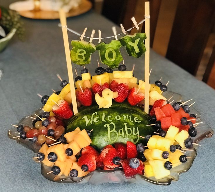 a baby shower made out of fruits and vegetables