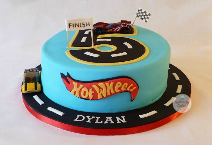 a birthday cake that is shaped like a race car