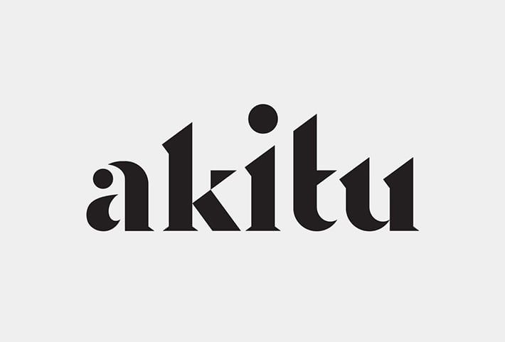 the word akltu is written in black and white letters on a white background