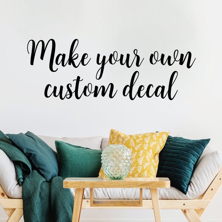 a wall decal that says make your own custom decal on the side of a couch