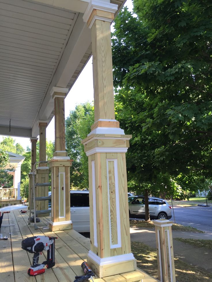 a porch with a clock on the side of it