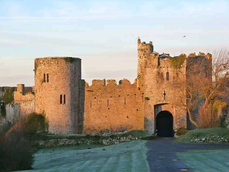 an old castle with a gate in the middle