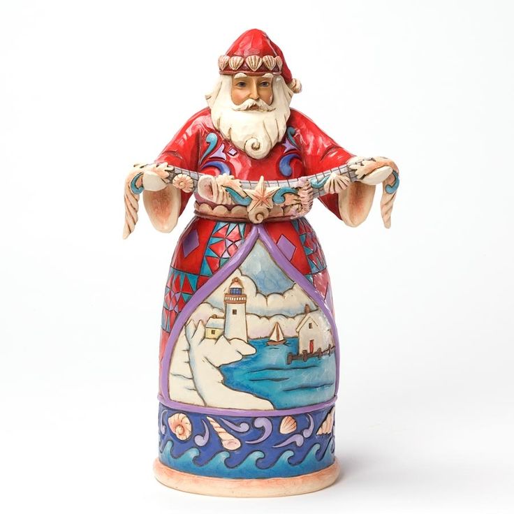 a ceramic figurine with a red hat and long white beard wearing a red outfit