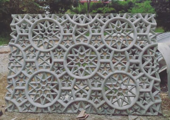 an intricately designed concrete block is shown in the foreground