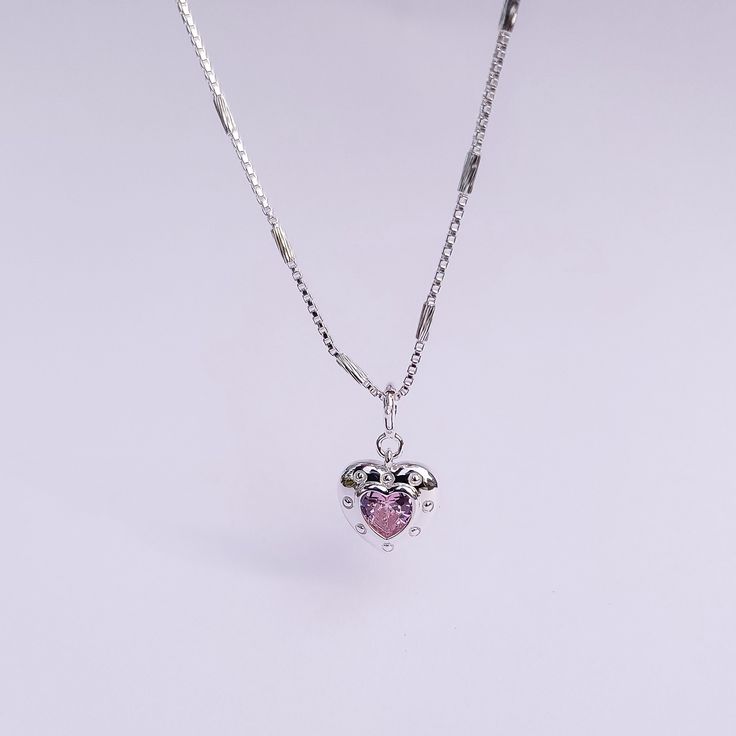 Introducing our Pink Glam Heart Necklace - crafted in Sterling Silver with a heart-shaped pink crystal at its core. This unique chain necklace features a sparkling pink crystal heart pendant, on a Sterling Silver heart shape base adding sophistication to any look. Wear it long or short with the adjustable clasp. Elevate your style with this enchanting piece that radiates love and glamour. Main Stone: heart shaped lab diamond Stone Color: pink Metal Material: 925 Sterling Silver Chain Lenght: 16 Pink Glam, Crystal Heart Pendant, Necklace Craft, 925 Sterling Silver Chain, Crystal Heart, Pink Crystal, Sterling Silver Heart, Lab Diamonds, Diamond Stone