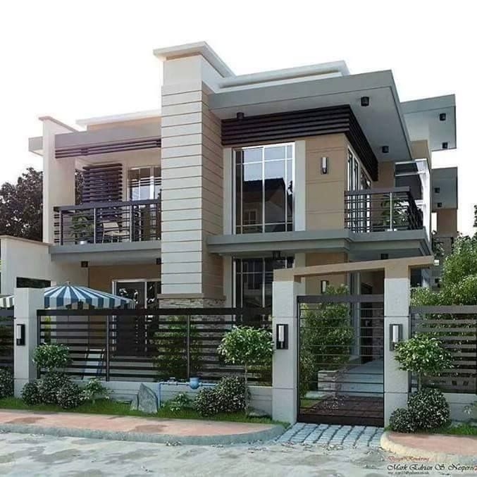 a two story house with an attached balcony and balconies on the second floor