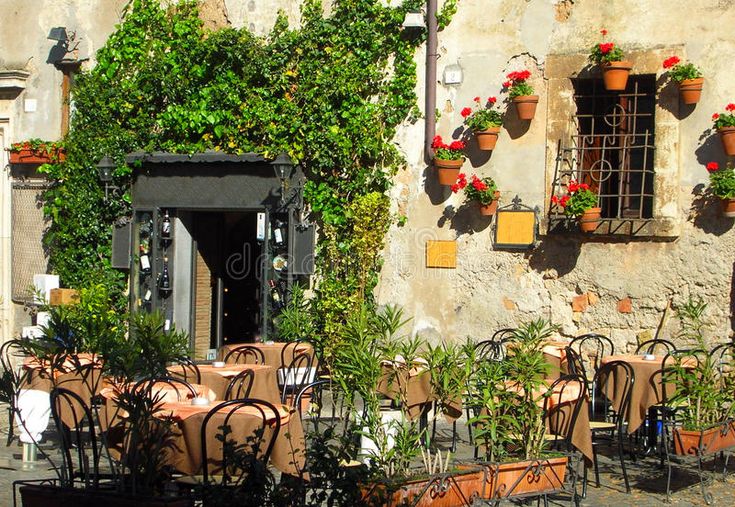  Italian  outdoor  cafe  and wine bar Empty chairs at an 