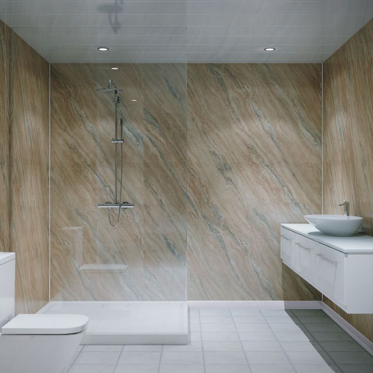 a modern bathroom with marbled walls and flooring, including a walk in shower