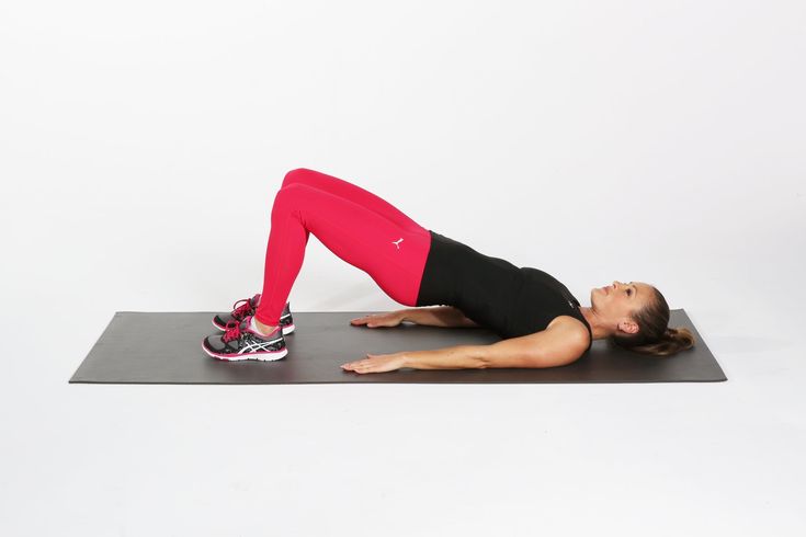 a woman is doing an exercise on a mat