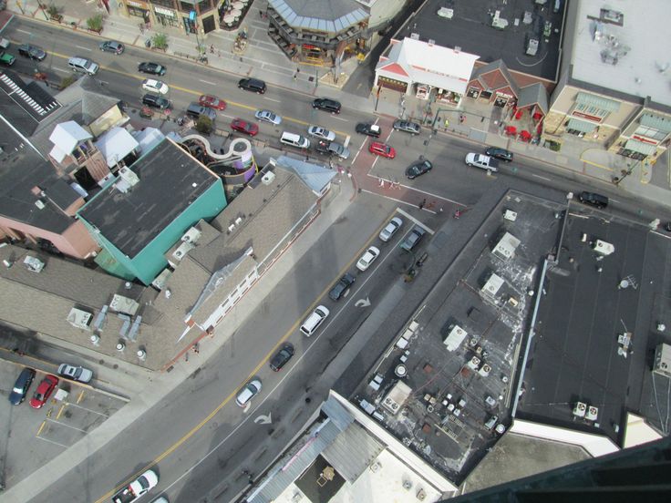 an aerial view of a city with cars and buildings