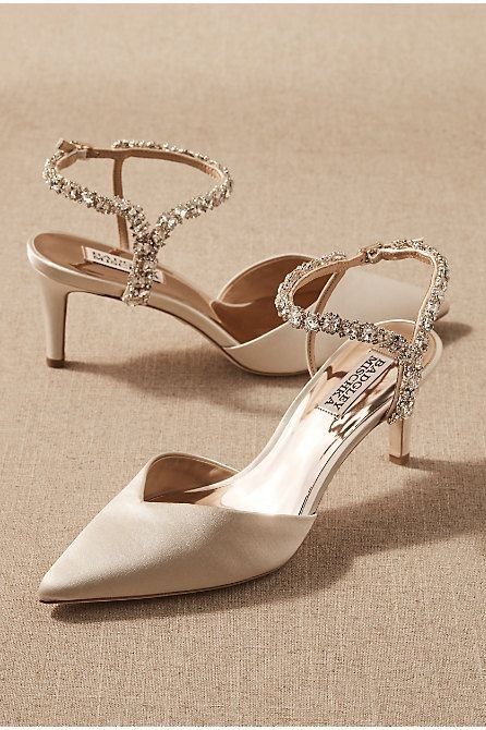 a pair of women's wedding shoes with jeweled straps