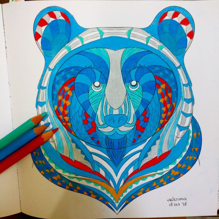 a drawing of a bear's head with blue, red and white designs on it