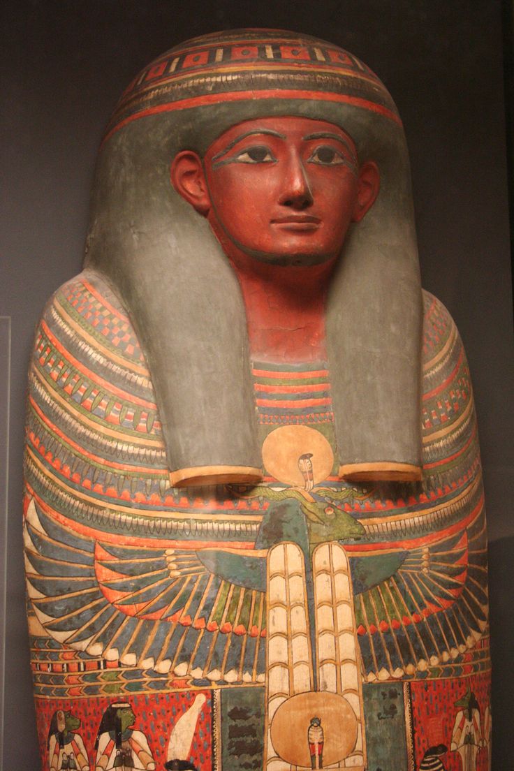 an egyptian statue is displayed in a museum