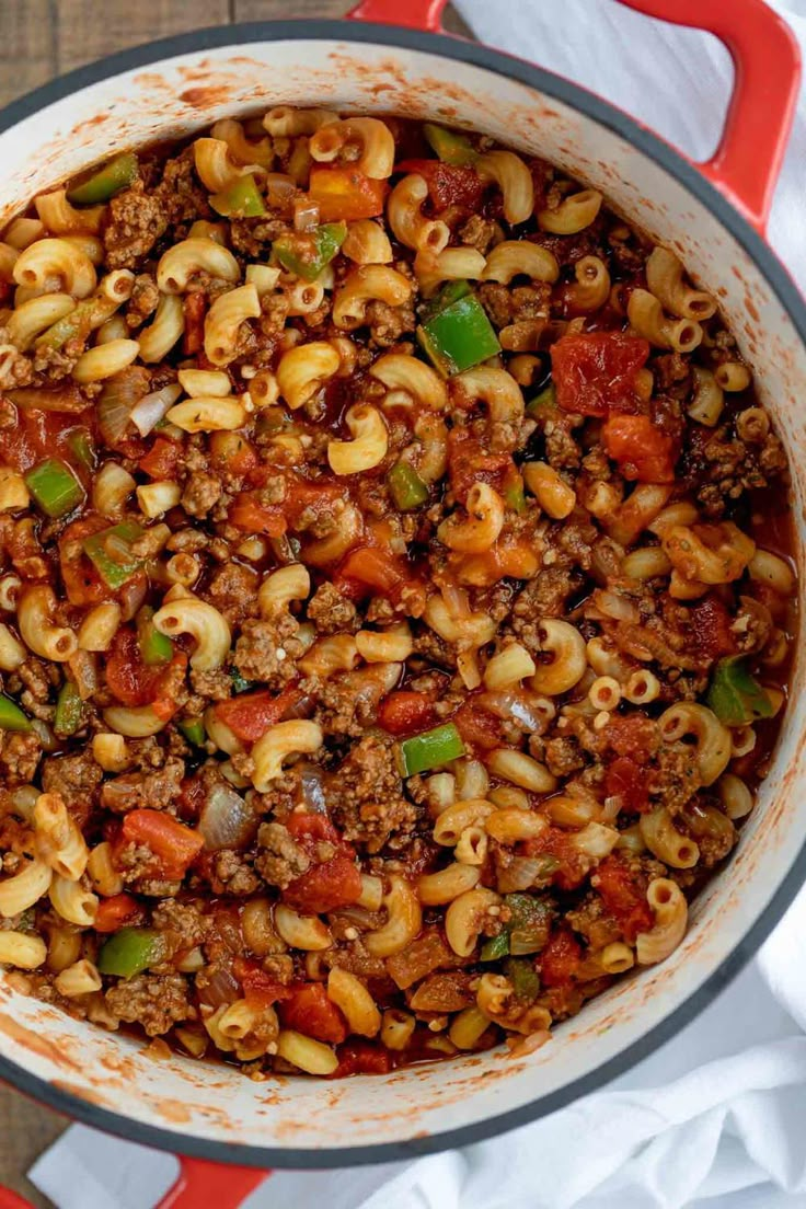 a pot filled with pasta and ground beef